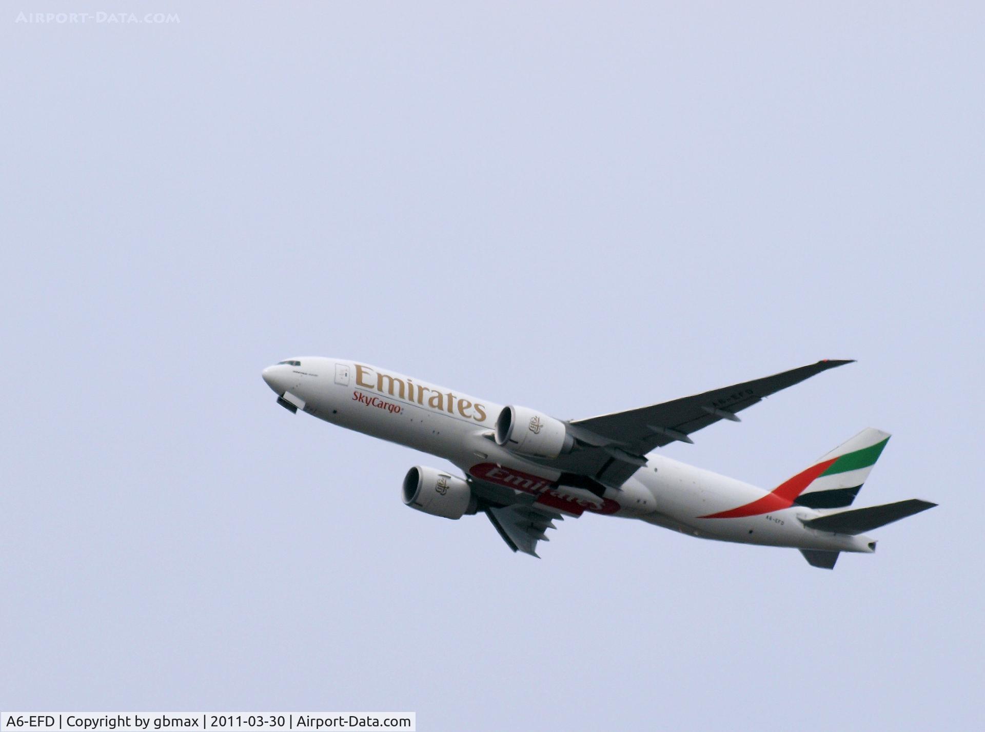 A6-EFD, 2009 Boeing 777-F1H C/N 35606, Flying over Mineola, NY, going to a landing at JFK
