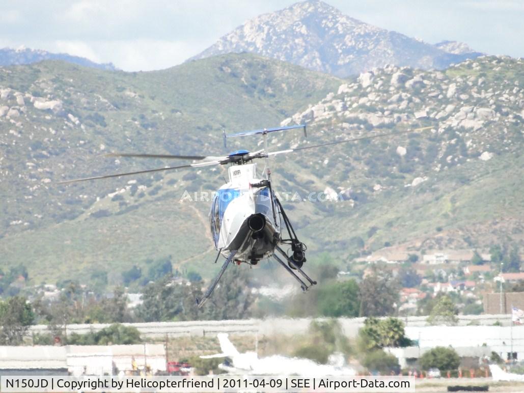 N150JD, 2000 MD Helicopters 369FF C/N 0710FF, Lifting off and heading north from runway 35
