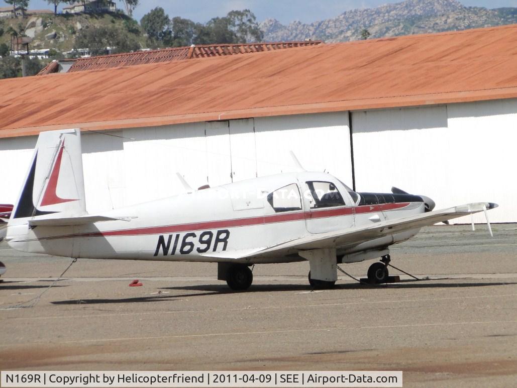 N169R, 1955 Mooney M20 C/N 1003, Parked near hangers