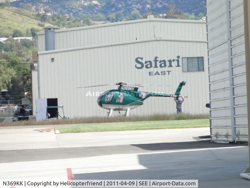 N369KK, 1977 Hughes 369D C/N 470125D, Parked near Safari East hanger