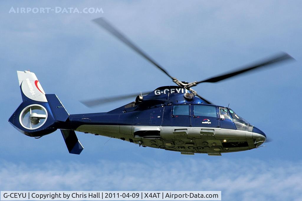 G-CEYU, 1988 Aerospatiale SA-365N-1 Dauphin 2 C/N 6298, Ferrying racegoers into Aintree for the 2011 Grand National