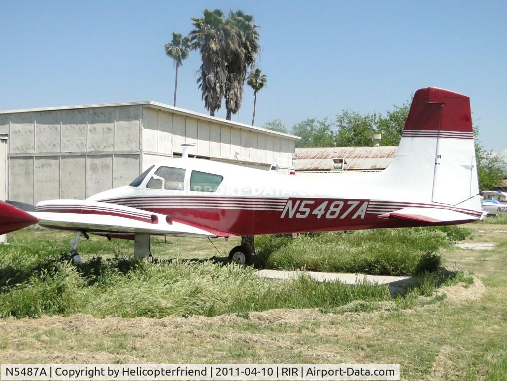 N5487A, 1958 Cessna 310B C/N 35687, Parked and tied down, rain made the grass grow rapidly