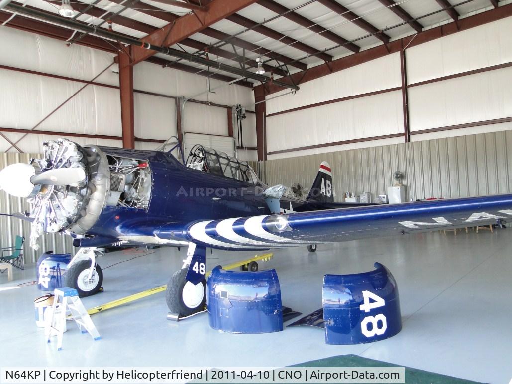 N64KP, 1943 North American AT-6D C/N 84936, Parked in the hanger having some engine work done on her