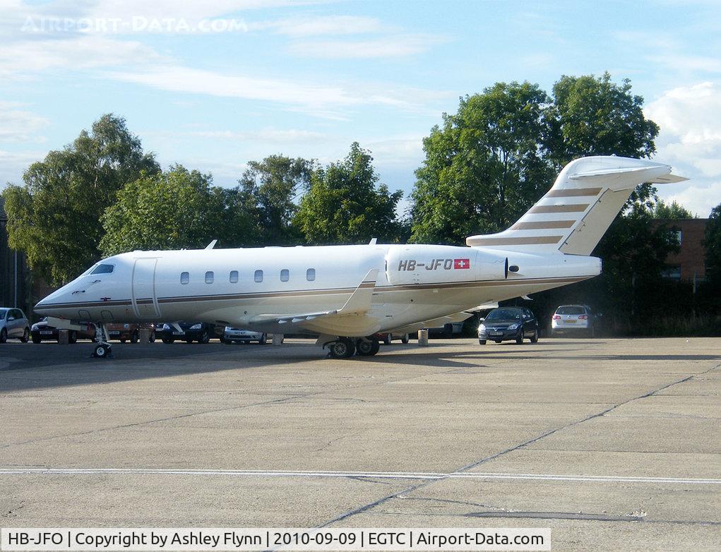 HB-JFO, 2006 Bombardier Challenger 300 (BD-100-1A10) C/N 20137, Arrived while me and my friend Tony were out flying. Taken from the window of Beech 19A Musketeer G-AWFZ.