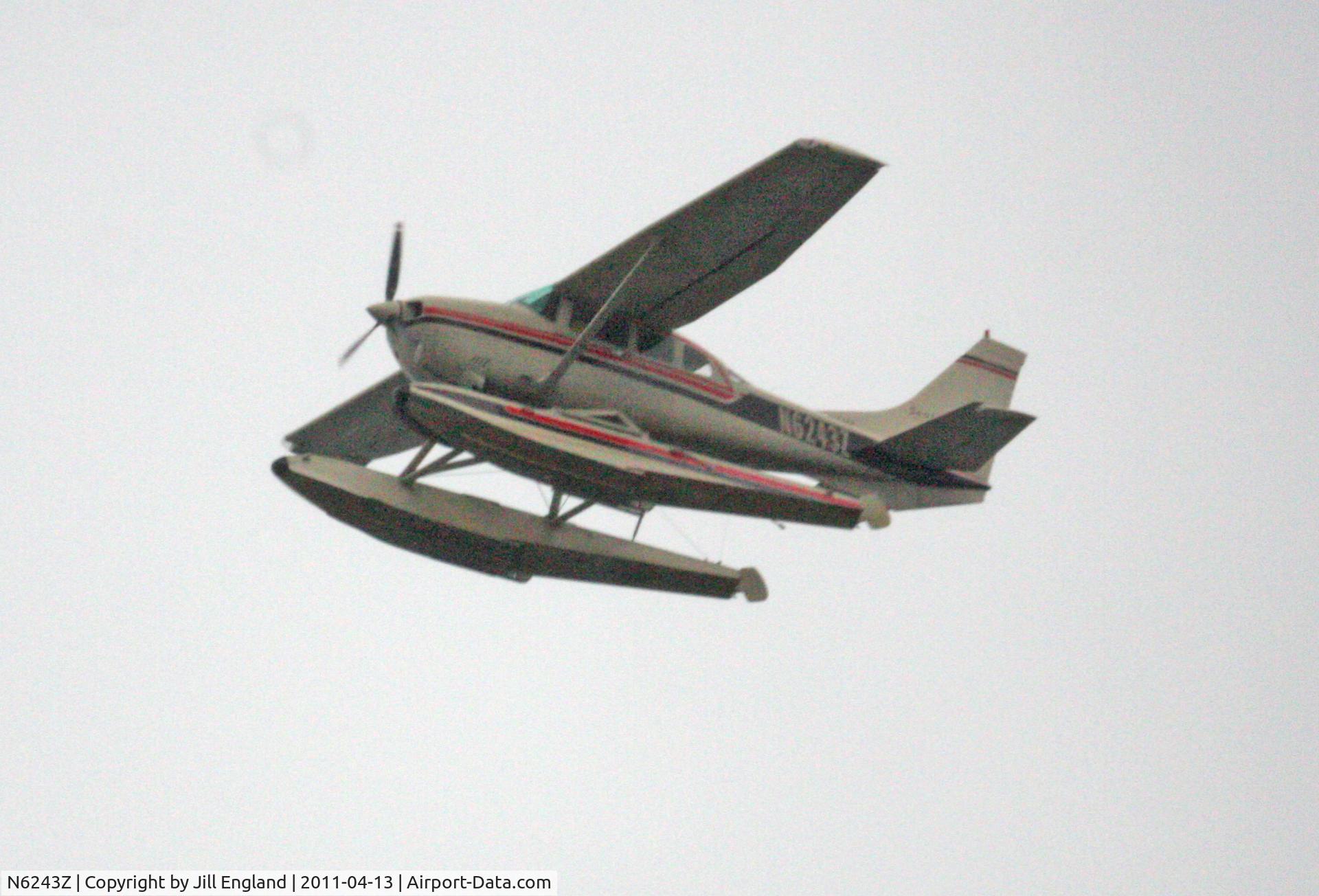 N6243Z, 1981 Cessna U206G Stationair C/N U20606199, Taken from Seattle Wells Fargo Tower.  Cannon EOS 40D with OM-SYSTEM ZUIKO 500 mm Reflex 1:8.
1:53:21pm
F8
1/1600 sec
ISO 1600
Photoshop for contrast and saturation