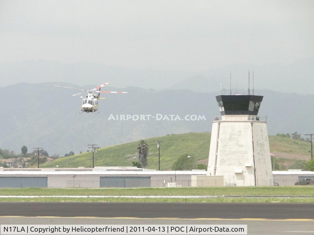 N17LA, 1992 Bell 412 C/N 36044, Taking off from taxiway near the tower and heading southeast to helipad