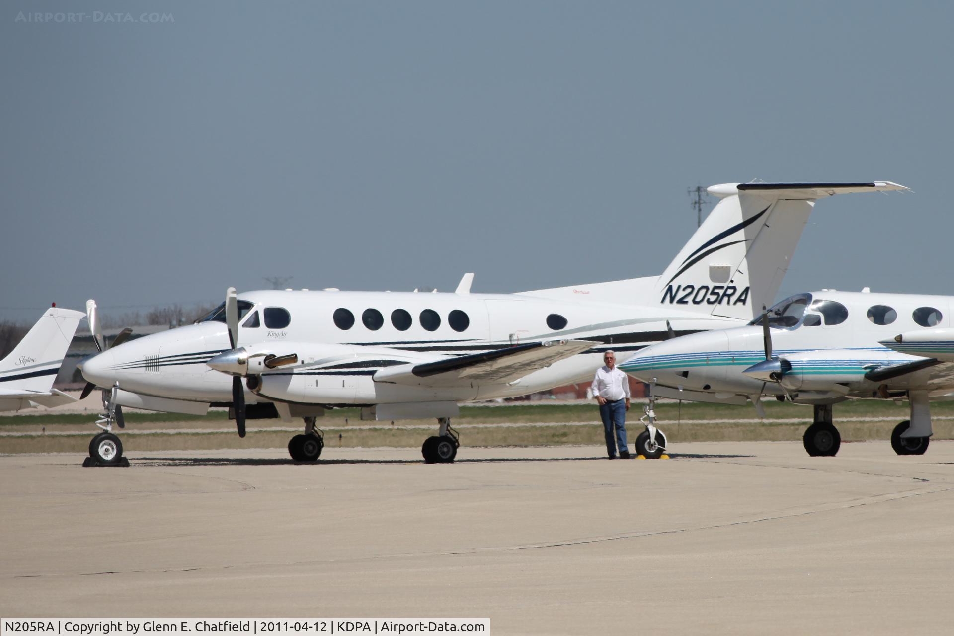 N205RA, Raytheon B200 King Air C/N BB-1919, Photographed through a chain-link fence