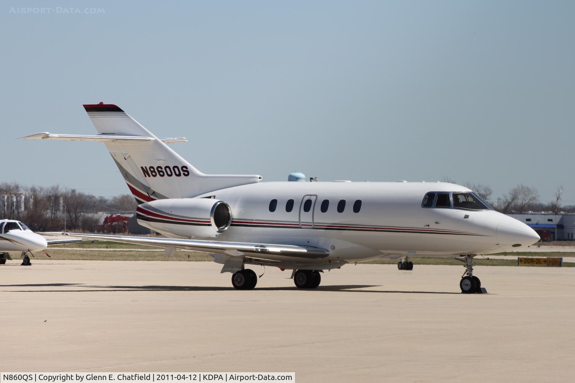 N860QS, 2004 Raytheon Hawker 800XP C/N 258698, Photographed through a chain-link fence.