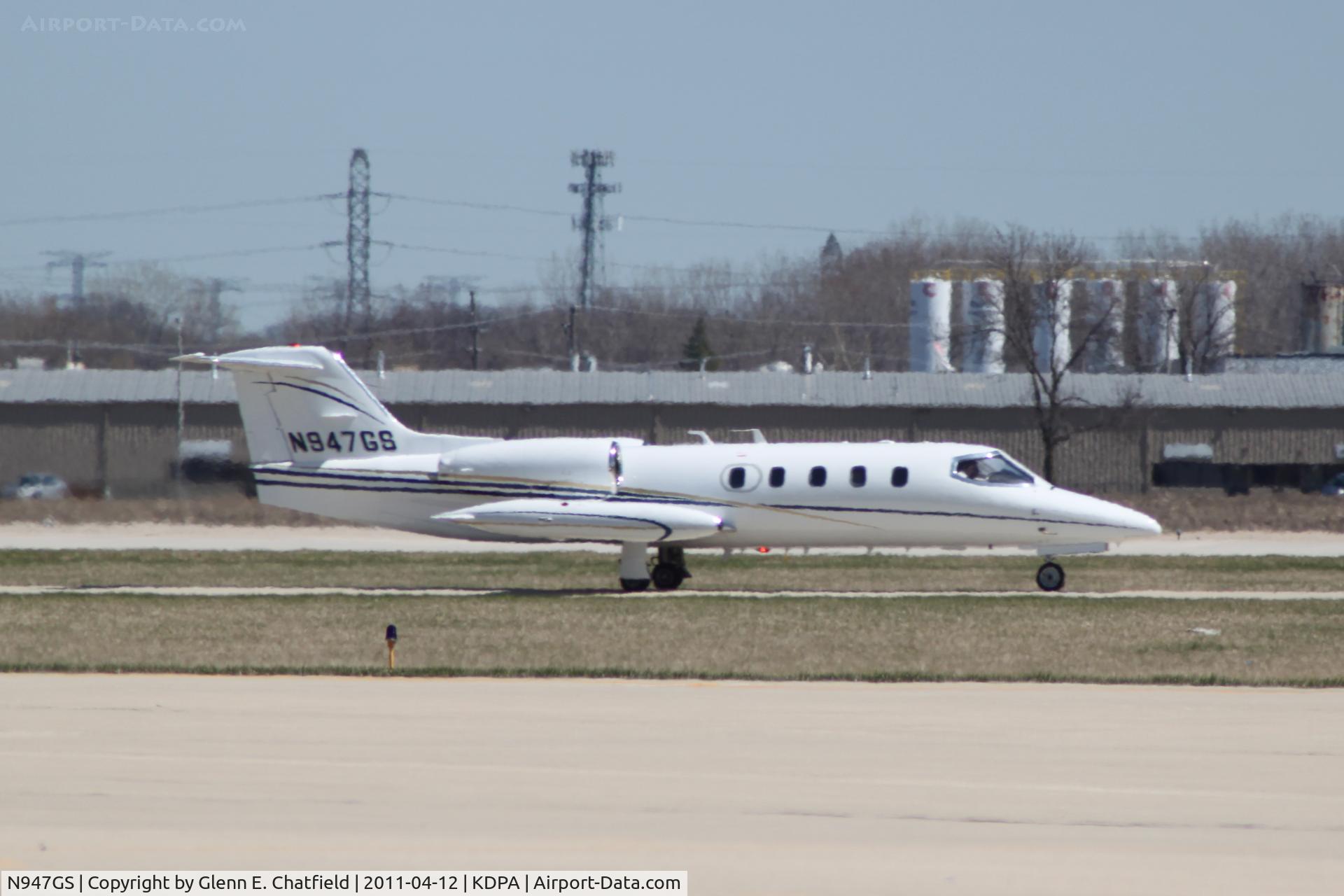 N947GS, 1979 Gates Learjet Corp. 35A C/N 250, Taxiing to Runway 2L.  Photographed through a chain-link fence.
