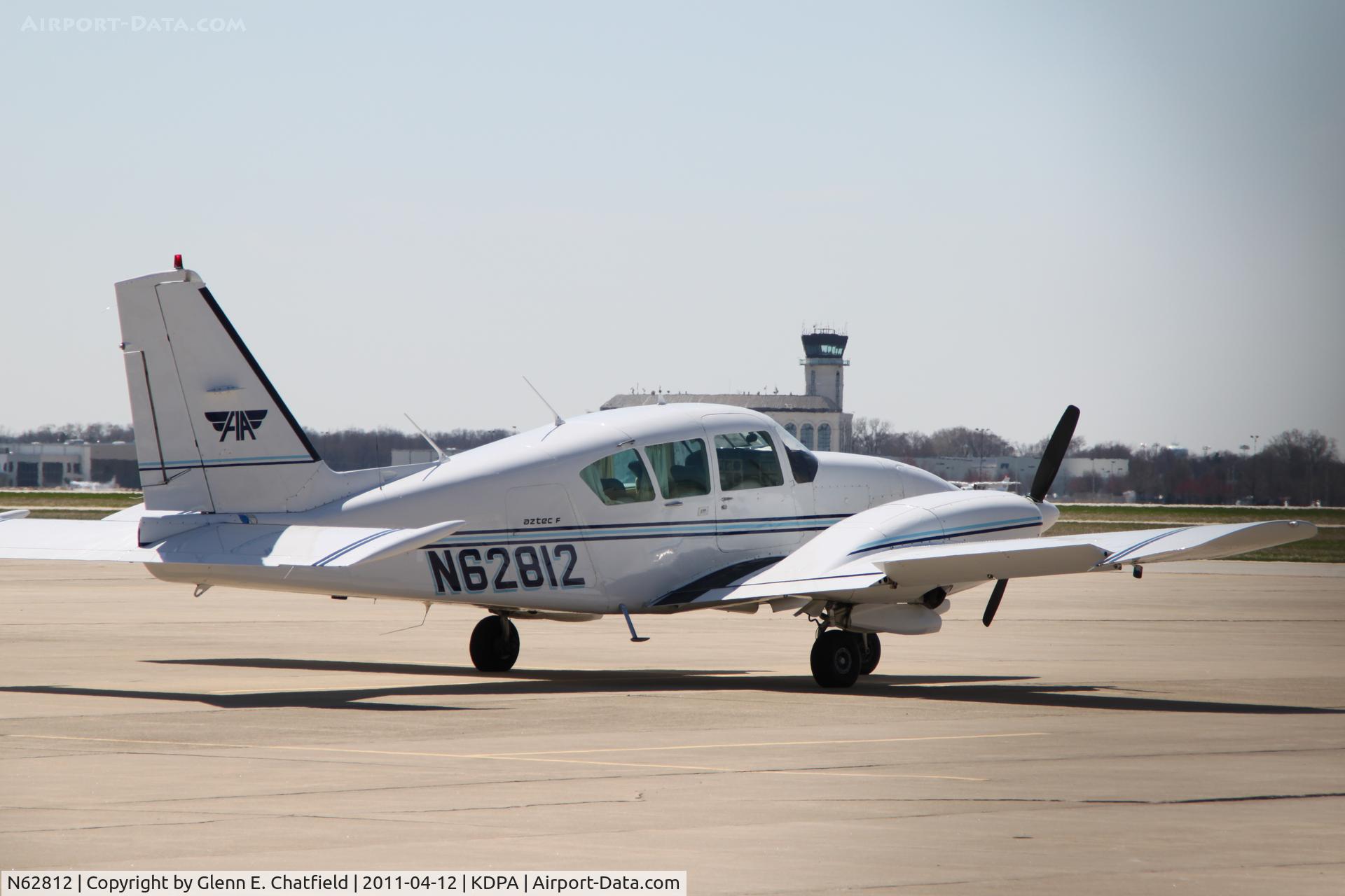 N62812, 1976 Piper PA-23-250 C/N 27-7754044, Photographed through a chain-link fence.  Parked on the east ramp