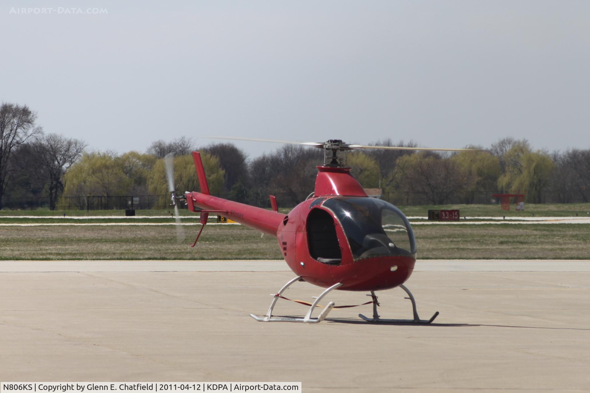 N806KS, 2004 Rotorway Exec 162F C/N 6425, On the east ramp, photographed through the chain link fence