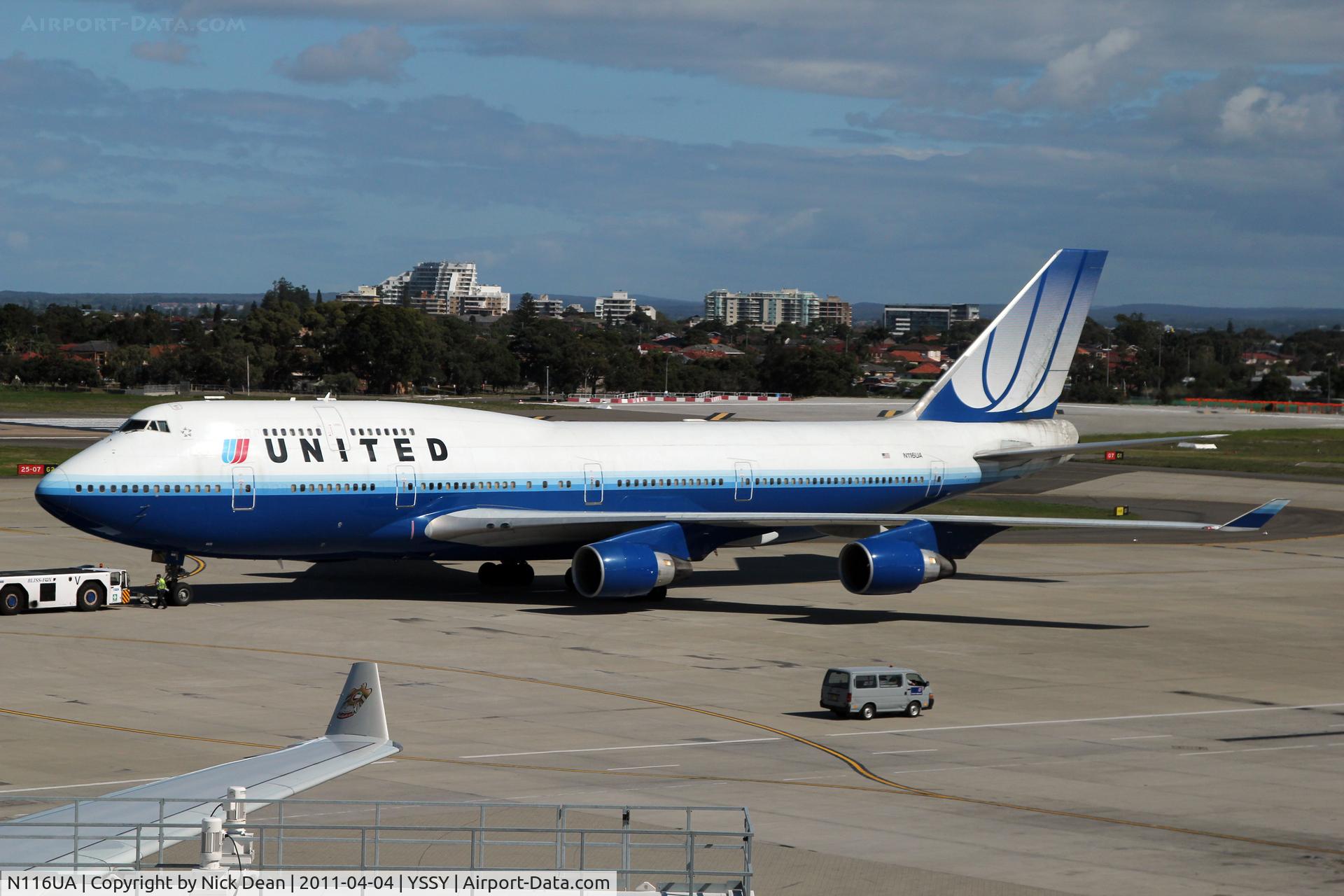 N116UA, 1998 Boeing 747-422 C/N 26908, YSSY Pushing back for UA840 SYD-LAX shot from the Air New Zealand lounge.