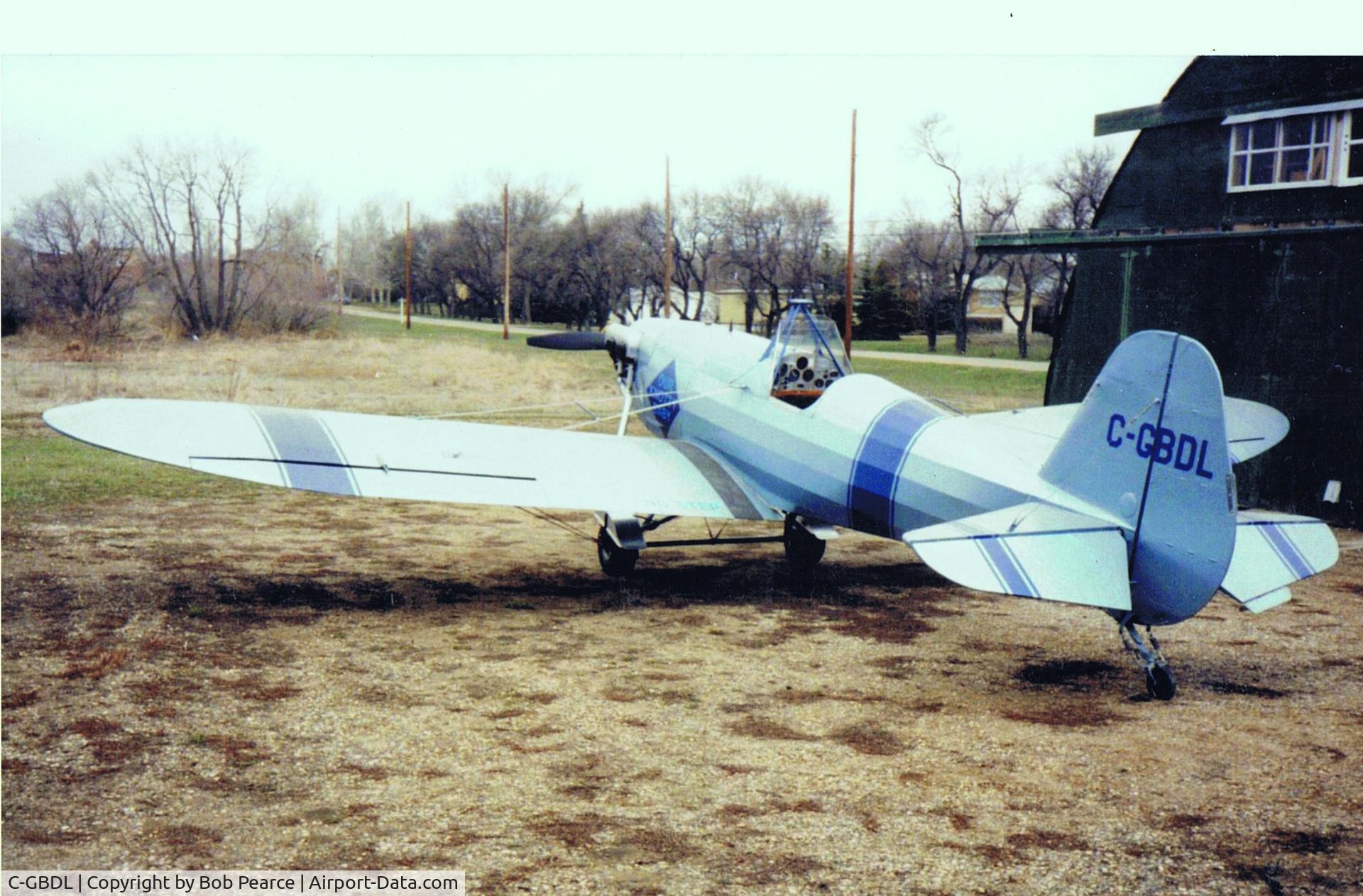 C-GBDL, 1998 Pearce SKYBABY II C/N 001, a 2 place tandem all wood aircraft of original design. The front cockpit cover and front windshield may be removed and stored in a tray placed in the front 'pit', along with a small amount of luggage. When removed and the windshield in place a passenger c