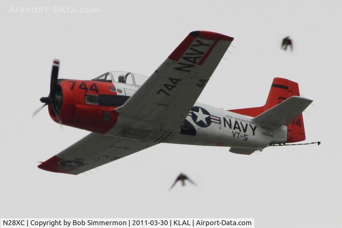 N28XC, 1954 North American T-28C Trojan C/N 226-91 (140514), Two birds peaceful day momentarily disturbed at Sun N Fun 2011.