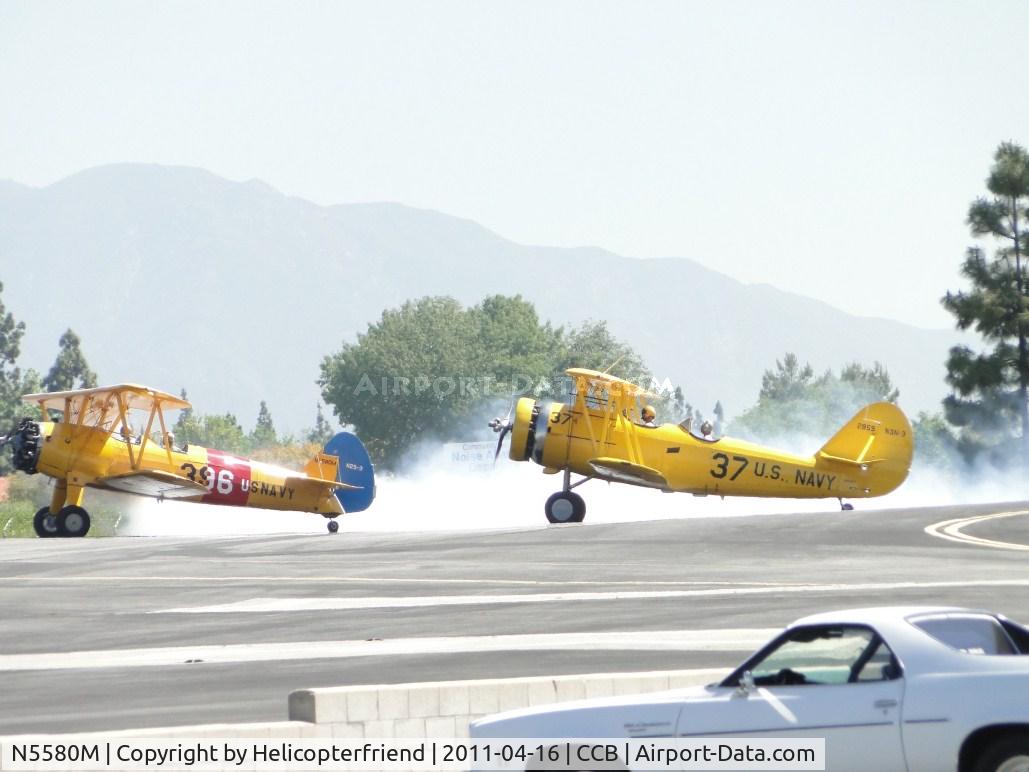N5580M, 1943 Boeing B75N1 C/N 75-7755, Looks like he's checking his smoke generator in front of N991PT