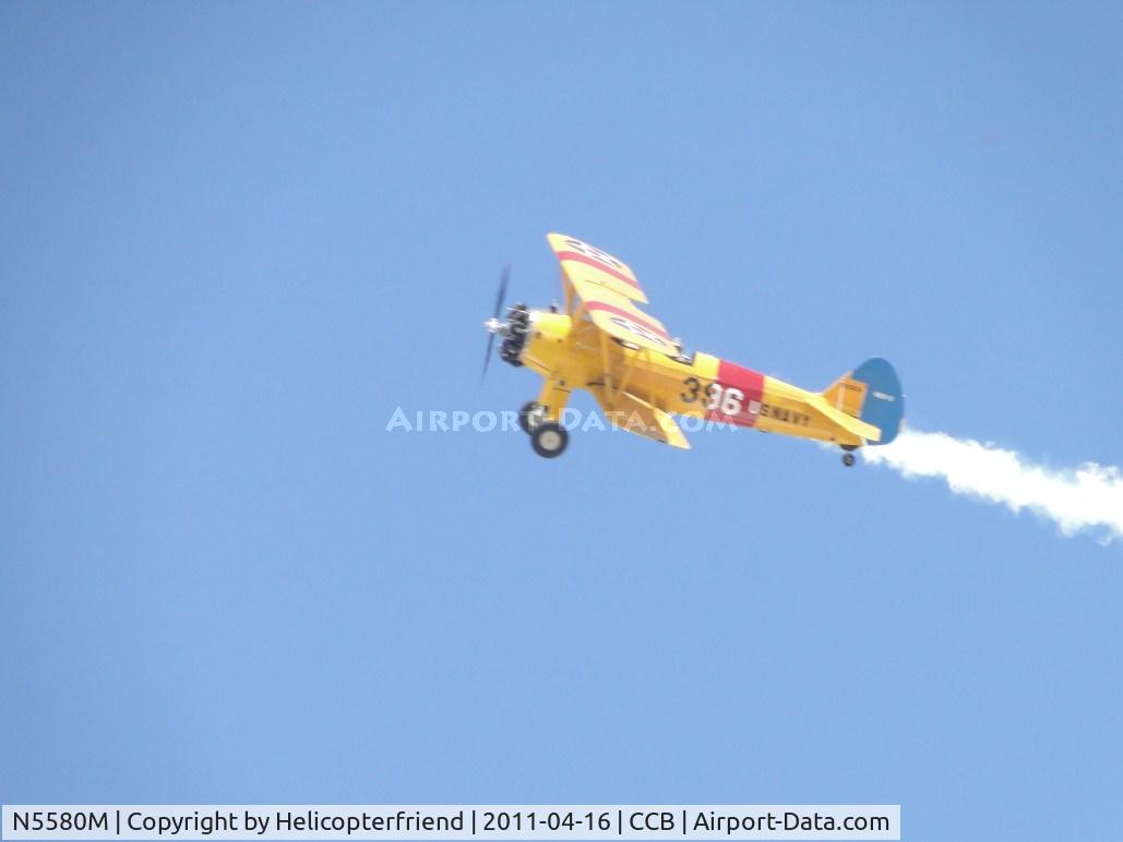 N5580M, 1943 Boeing B75N1 C/N 75-7755, Using smoke generator after peeling off from flight of two heading towards downwind