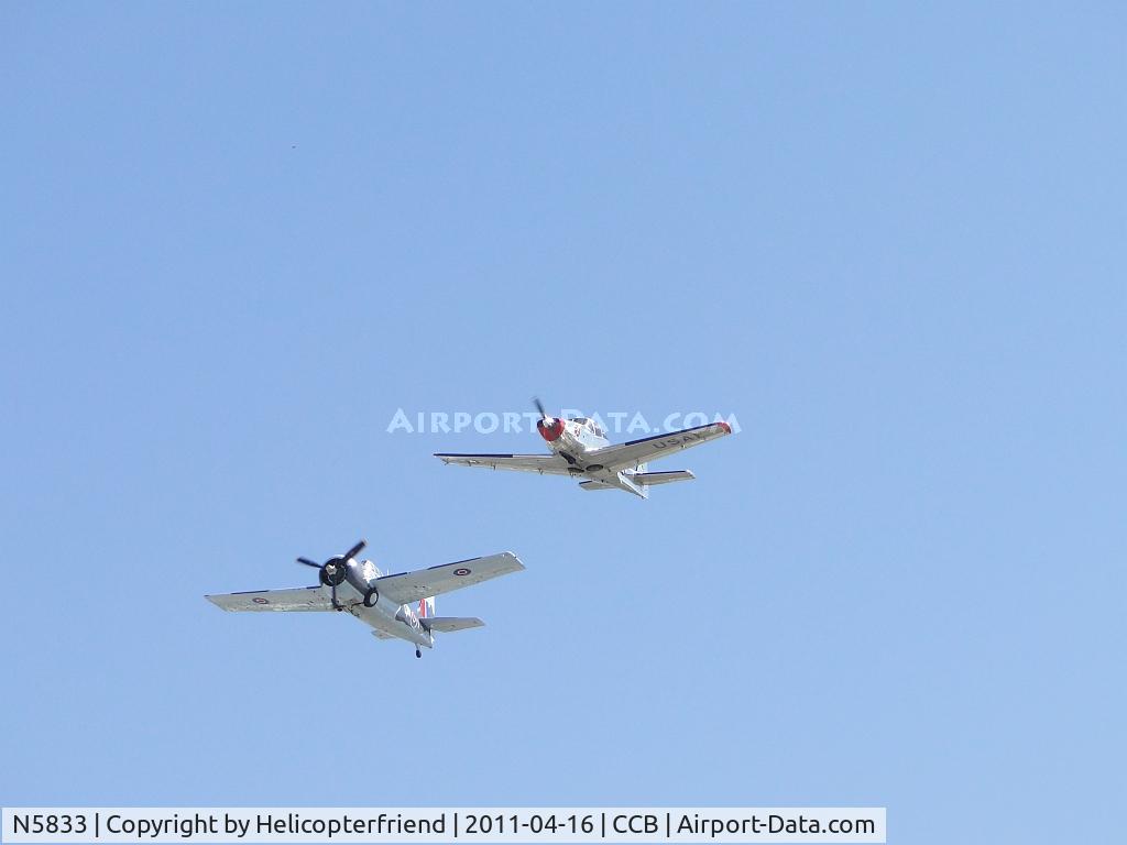 N5833, 1945 General Motors (Grumman) FM-2 Wildcat C/N 5833, Leading 2 plane formation over runway 24 with N91707
