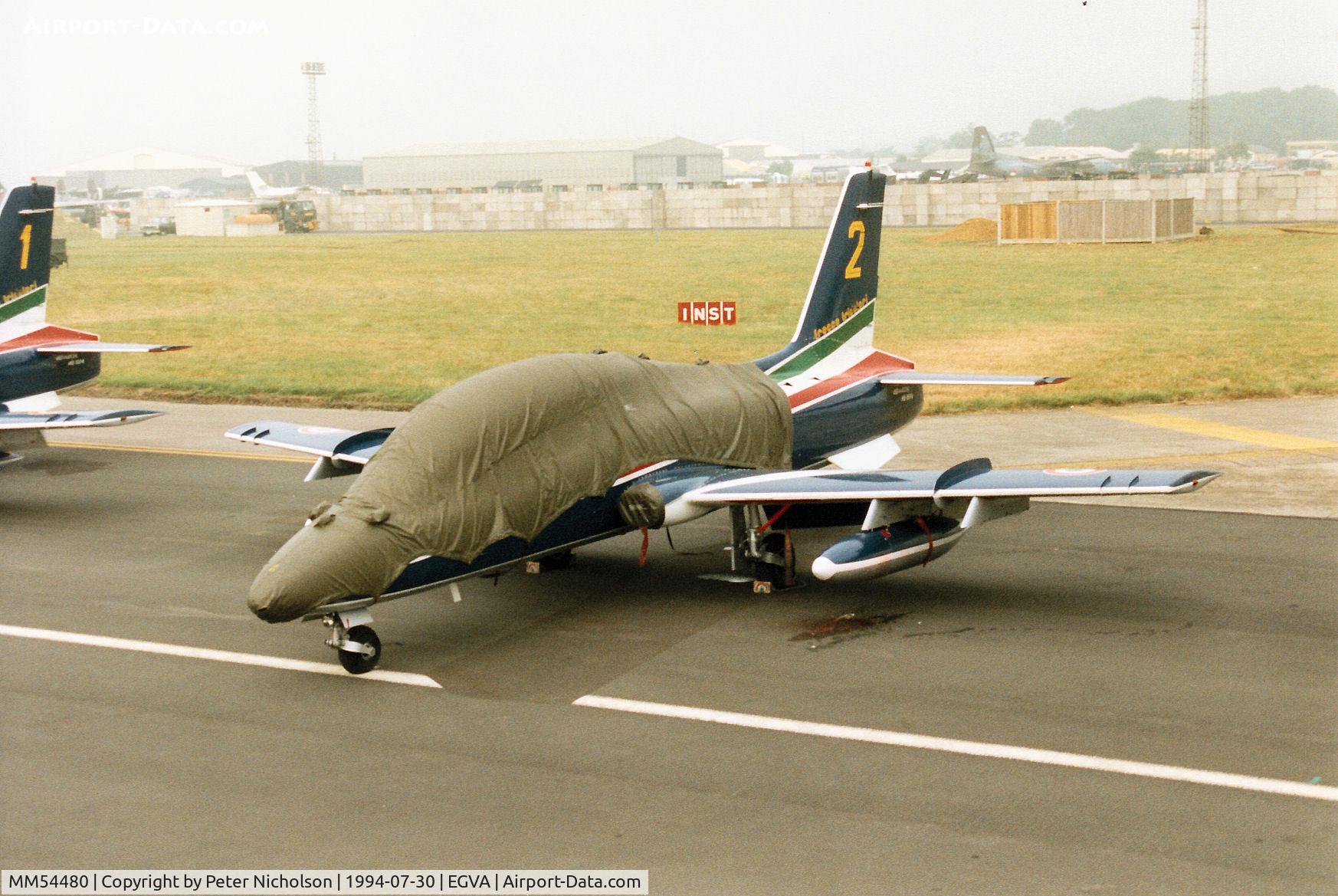 MM54480, Aermacchi MB-339PAN C/N 6675/070/AD009, Aircraft number 2 of the Italian Air Force's Frecce Tricolori aerobatic display team on the flight-line at the 1994 Intnl Air Tattoo at RAF Fairford.