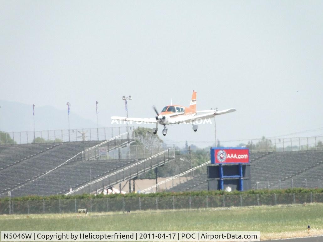 N5046W, 1961 Piper PA-28 C/N 28-48, On final, past the outer fence for 26R