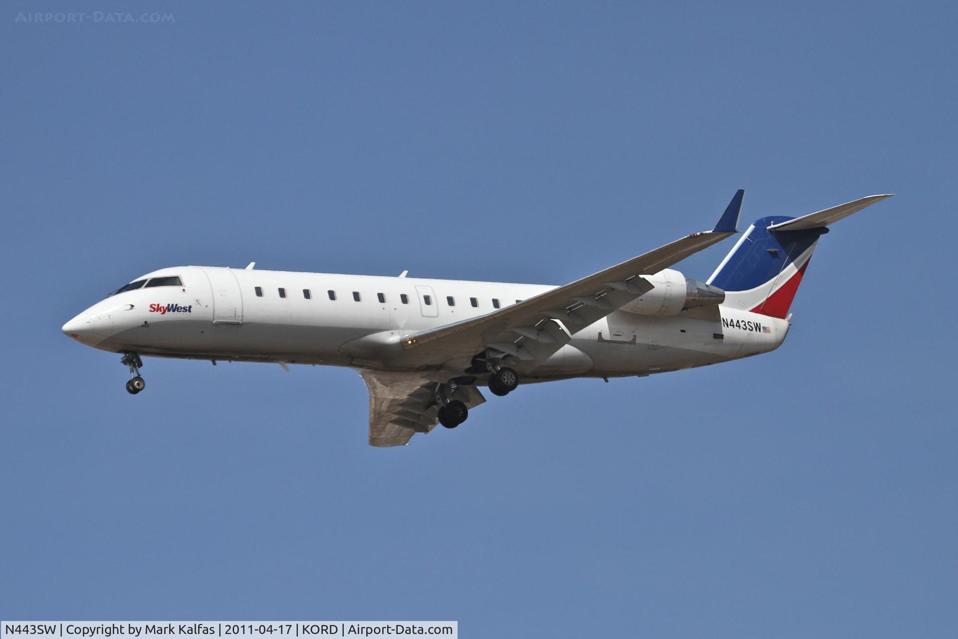 N443SW, 2002 Bombardier CRJ-200LR (CL-600-2B19) C/N 7638, SkyWest Bombardier CL-600-2B19, SKW7030 arriving from KMLI, RWY 28 approach KORD.