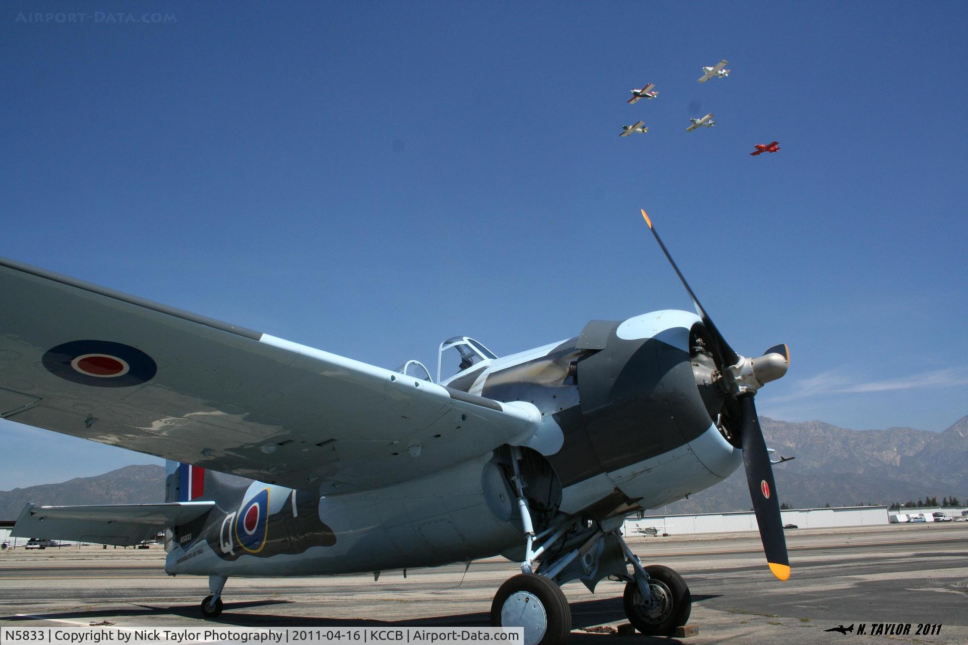 N5833, 1945 General Motors (Grumman) FM-2 Wildcat C/N 5833, A flight of RV's makes a pass over the CAF's FM-2 Martlett at Cable