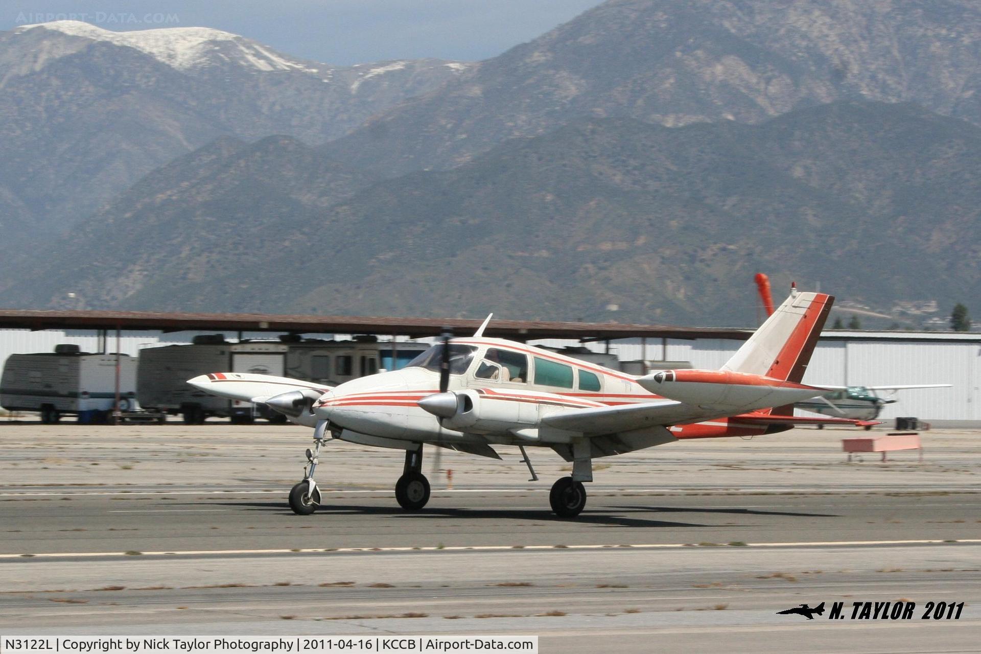 N3122L, 1965 Cessna 310J C/N 310J0122, 310 touching down on RWY 24 at Cable