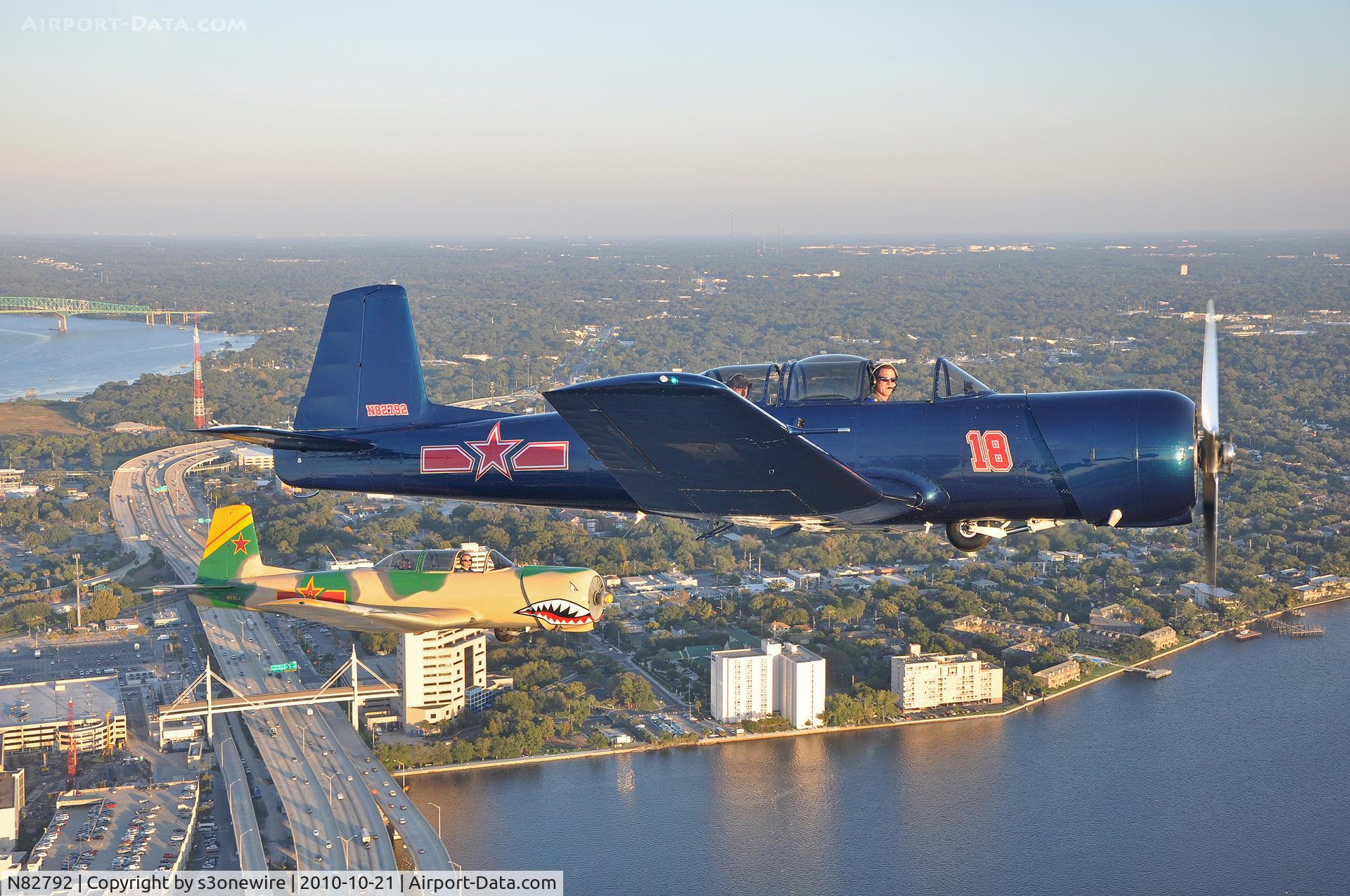 N82792, 1976 Nanchang CJ-6A C/N 2932018, W/ N53CJ over downtown Jacksonville, Fl
