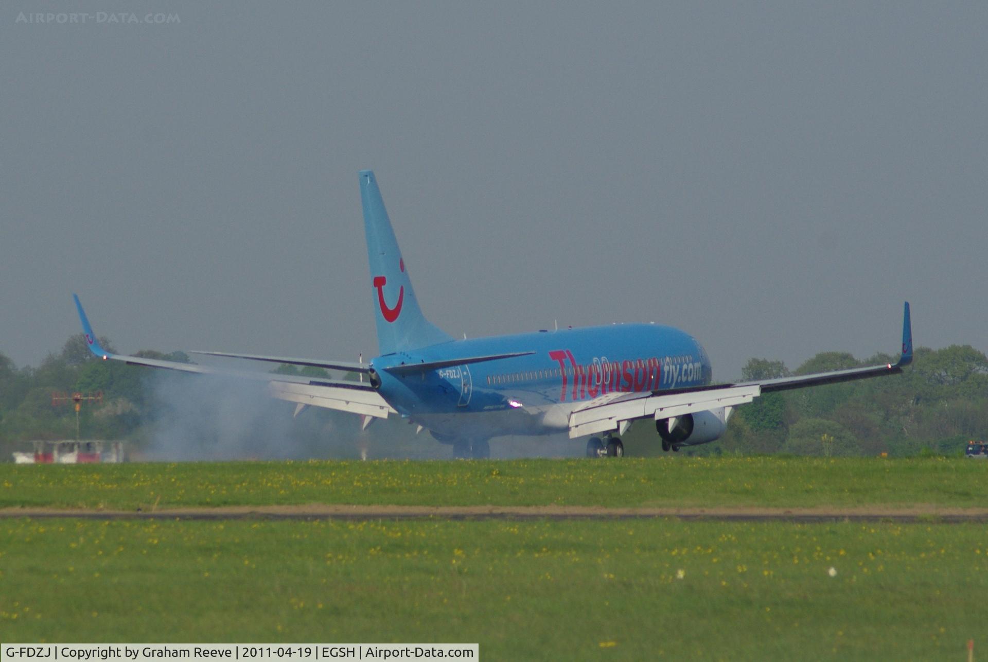 G-FDZJ, 2007 Boeing 737-8K5 C/N 34690, Smoking the tyres.