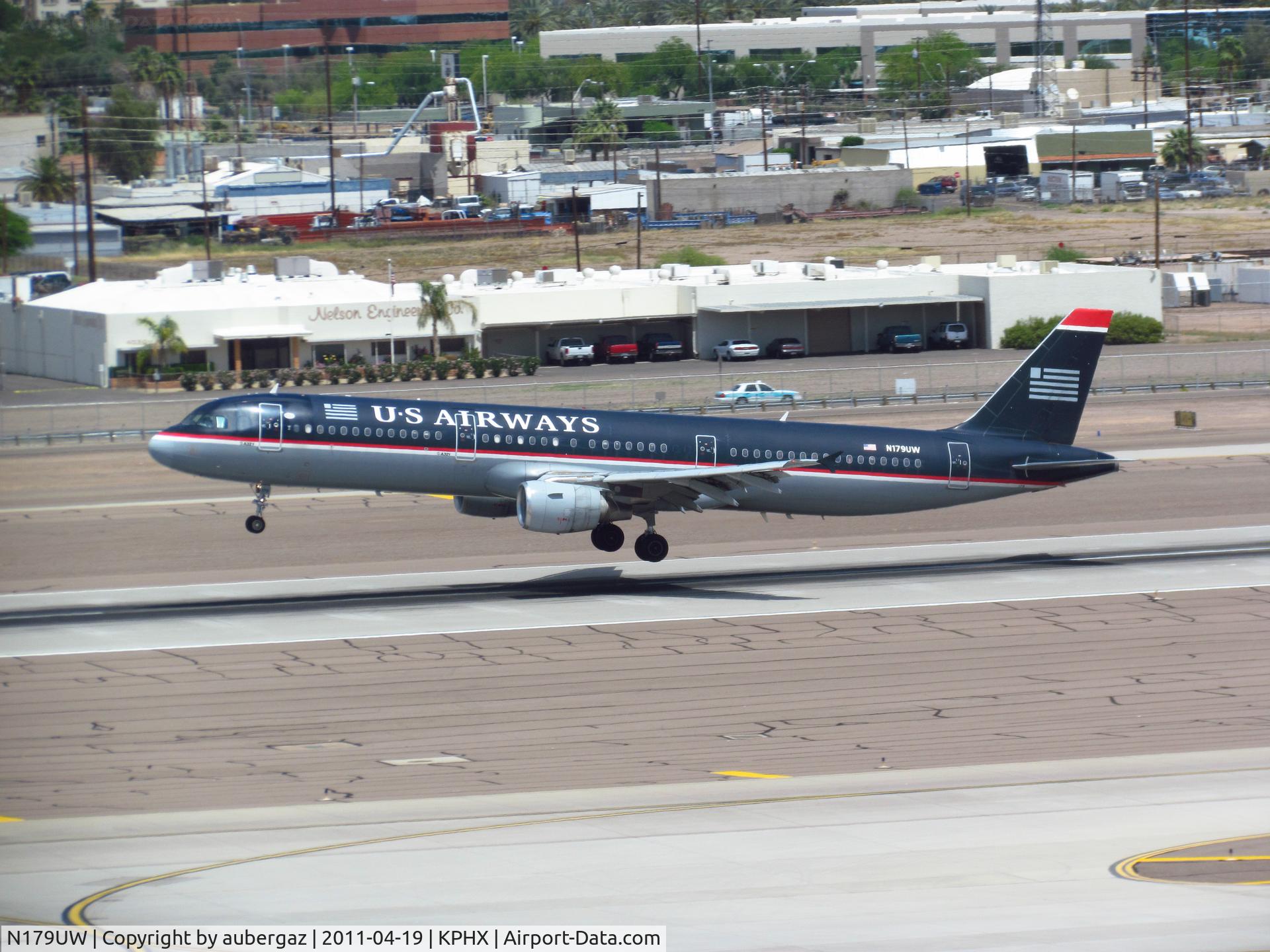 N179UW, 2001 Airbus A321-211 C/N 1521, One of the last of of dark blue 'Airways' planes landing on runway 26 at PHX