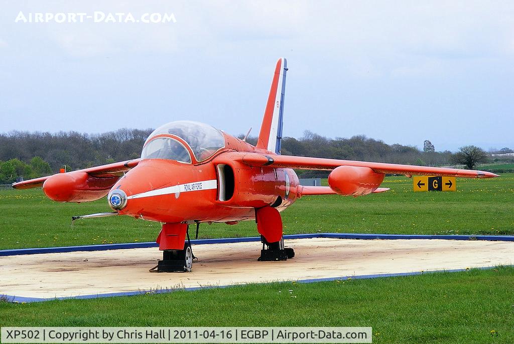 XP502, 1962 Folland Gnat T.1 C/N FL517, Gnat T1 first entered service with 4FTS in 1962, preserved in front of the tower in Red Arrows colours although it never flew with them.
