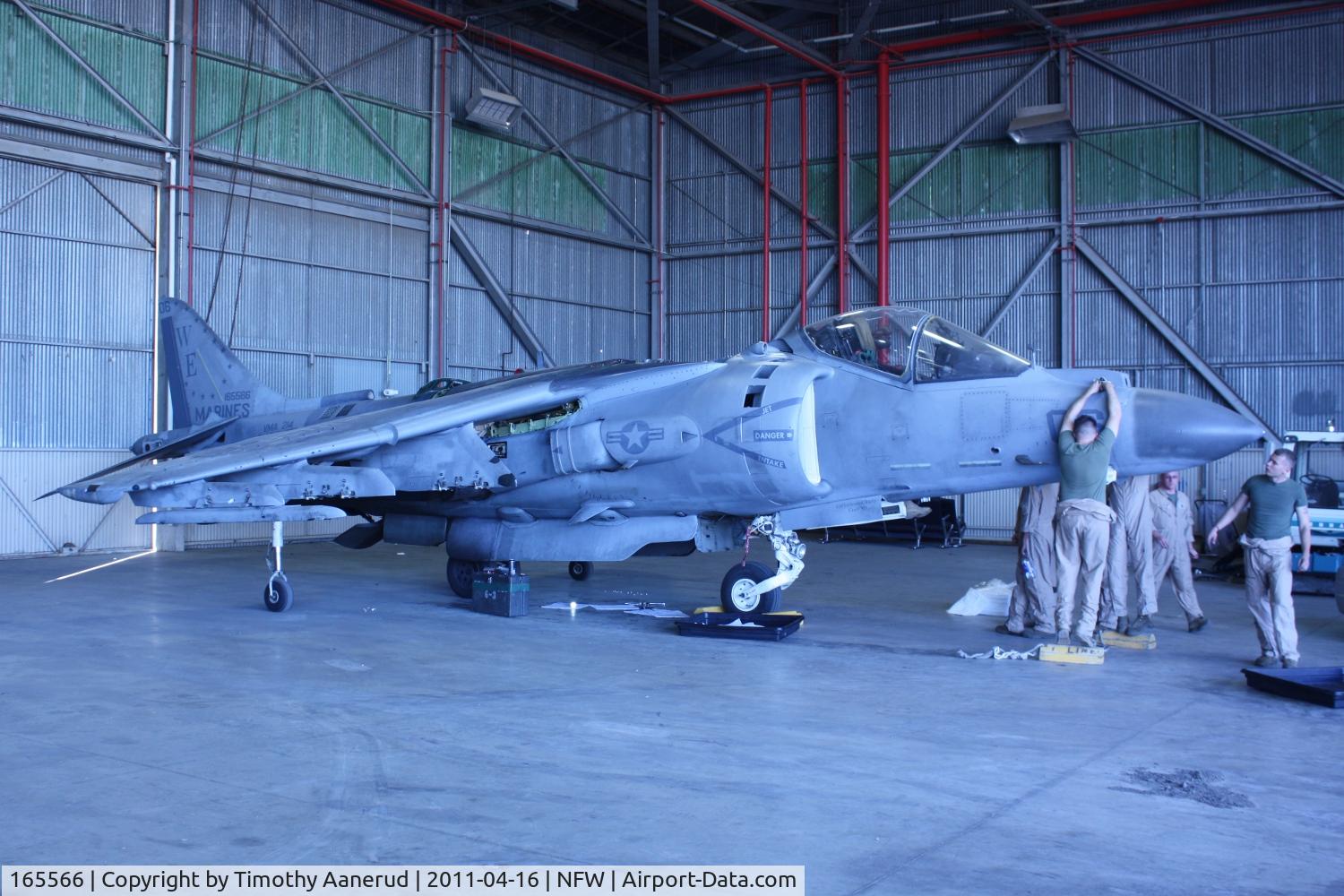 165566, Boeing AV-8B+(R)-27-MC Harrier II Plus C/N B303, Boeing AV-8B Harrier II+, c/n: 303; Air Expo 2011, In the hangar getting its engine replaced.  It ate the runway. Oops.