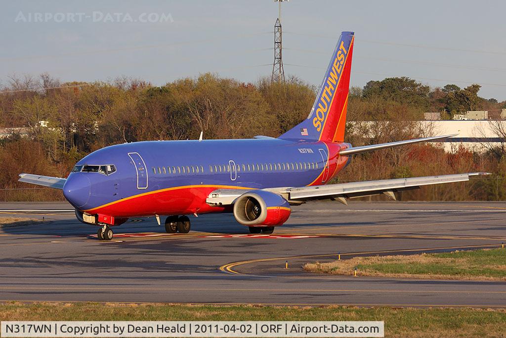 N317WN, 1988 Boeing 737-3Q8 C/N 24068, Southwest Airlines N317WN exiting RWY 5 after landing.