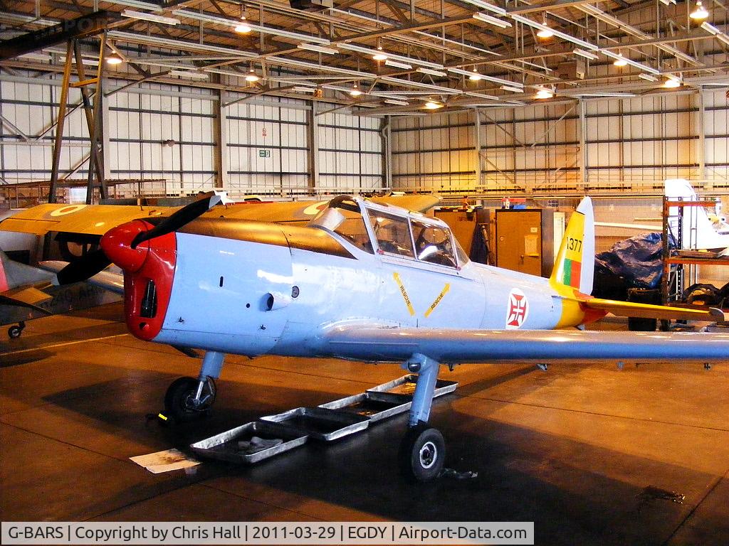 G-BARS, 1952 De Havilland DHC-1 Chipmunk T.10 C/N C1/0557, inside the 727 NAS Hangar. In Portugese Air Force colours and wearing the serial 1377