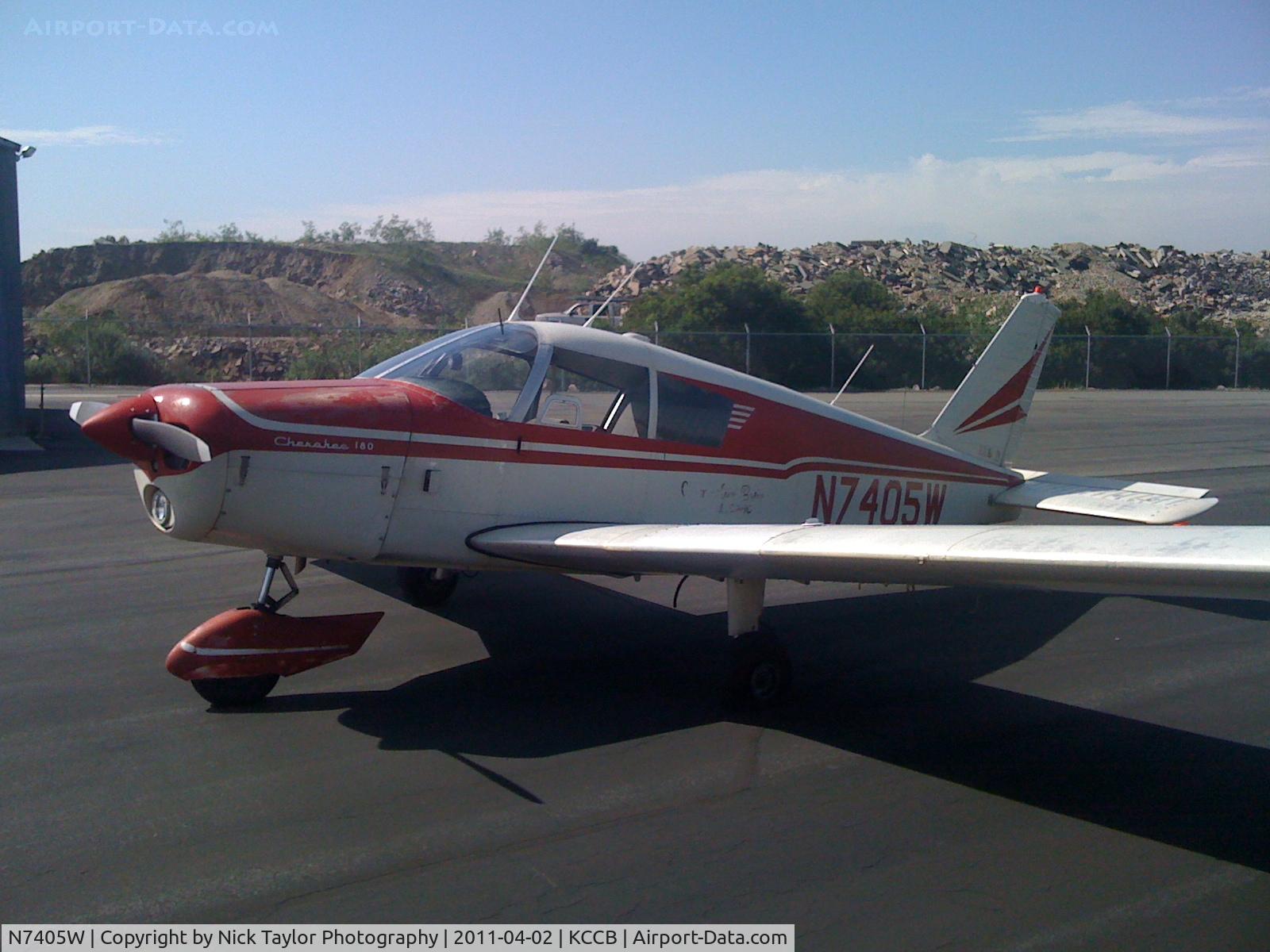 N7405W, 1963 Piper PA-28-180 C/N 28-1291, Parked with a flat tire at Cable