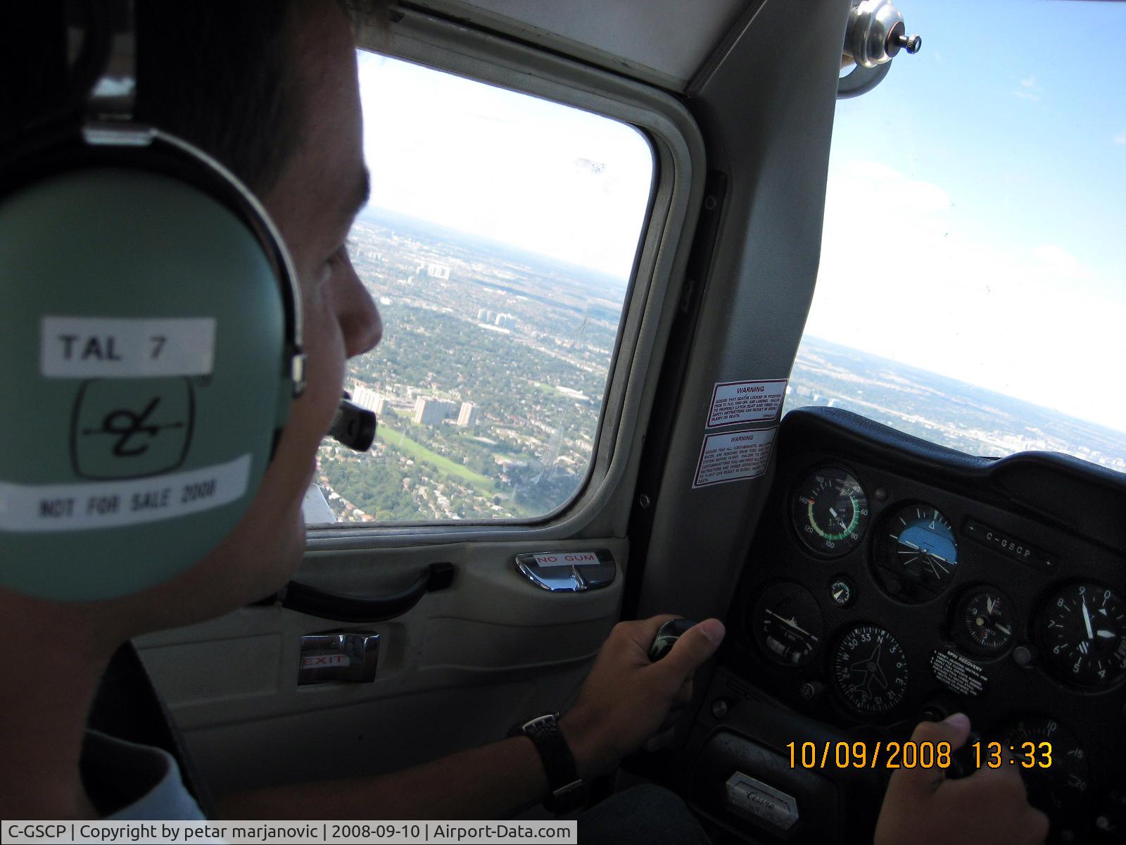 C-GSCP, 1977 Cessna 150M C/N 15079191, in flight over toronto