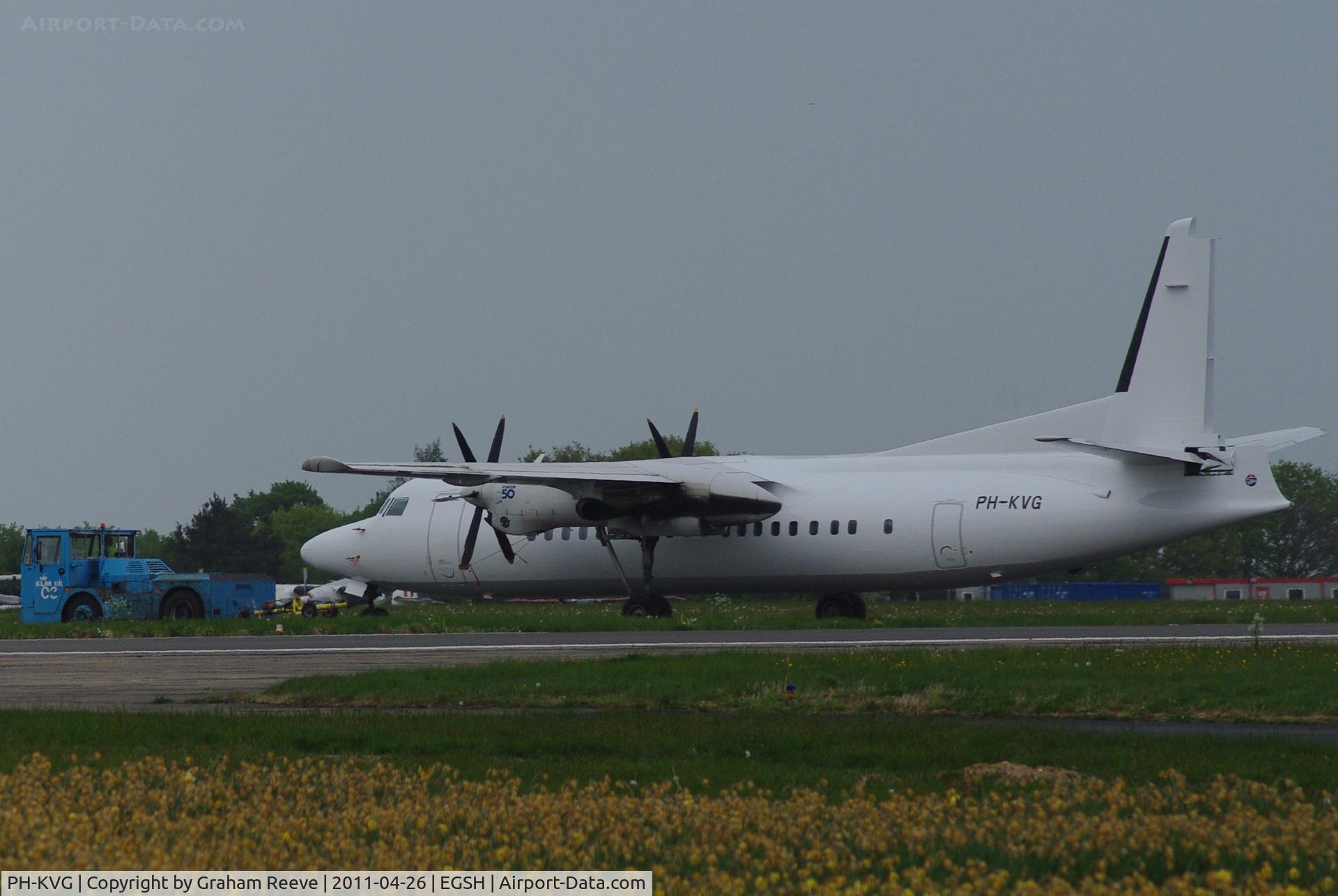 PH-KVG, 1991 Fokker 50 C/N 20211, Now painted all white and being towed to the storeage area.