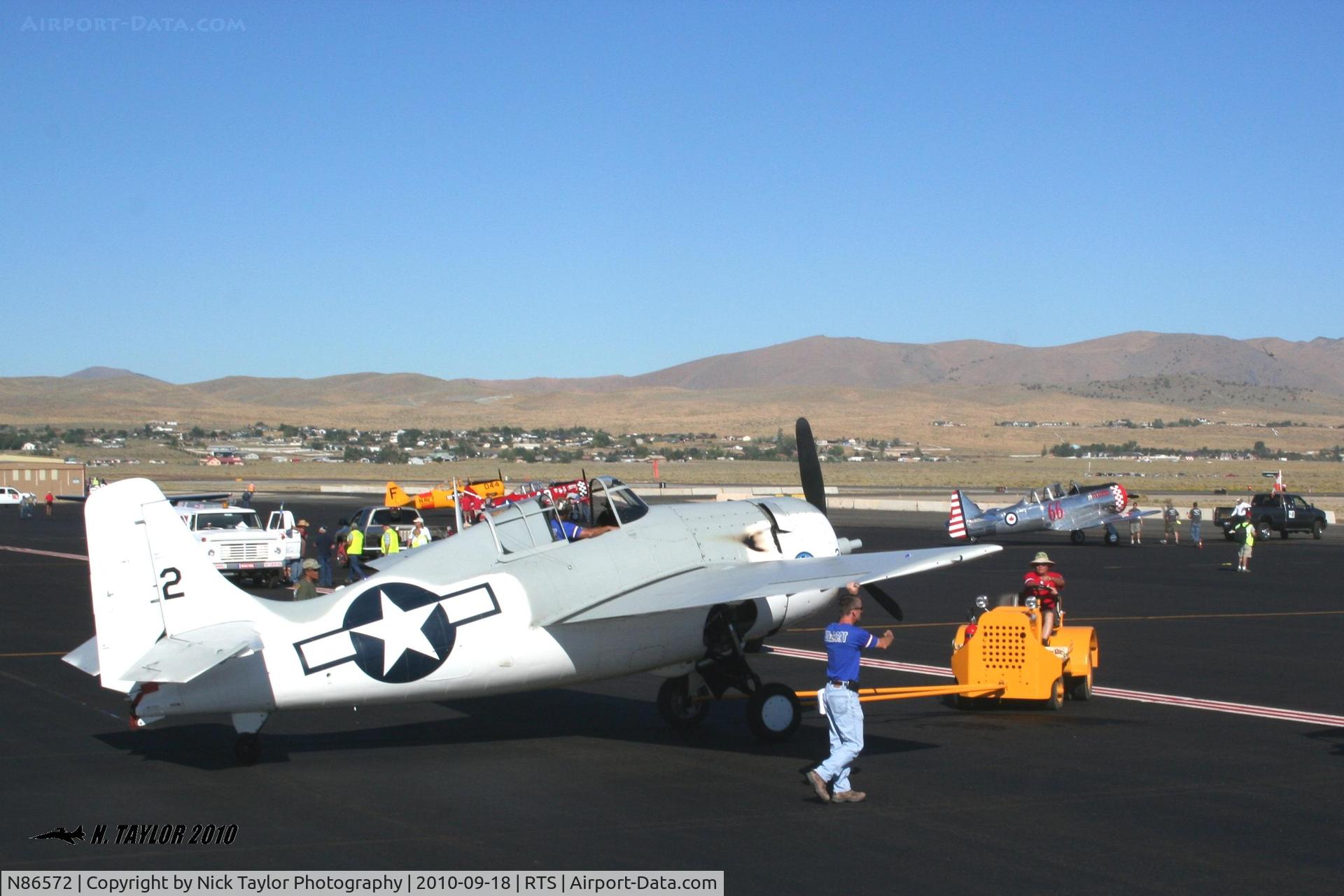 N86572, General Motors (Grumman) FM-2 Wildcat C/N 5626, As seen from the firetruck celebrating Jon Gourley's win in the Saturday Biplane heat race.