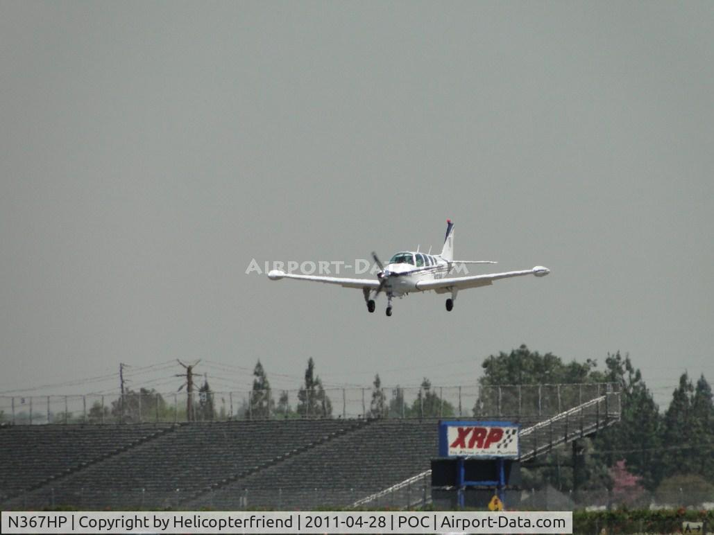 N367HP, 1981 Beech A36 Bonanza 36 C/N E-1811, Passing over the outer fence on final for runway 26L