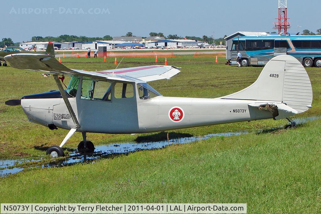 N5073Y, Cessna 305A C/N 21714, Storm battered at 2011 Sun n Fun Lakeland , Florida