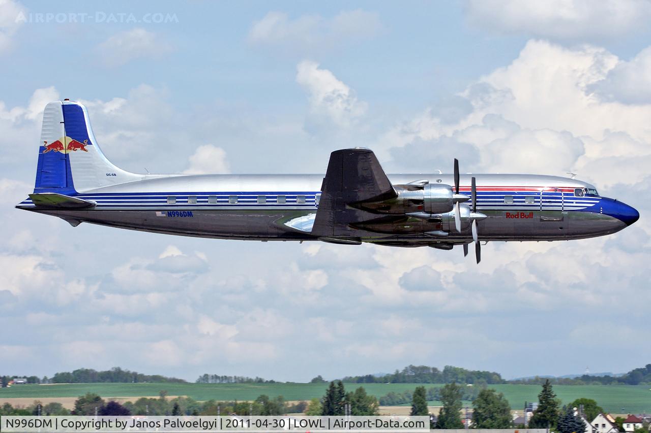 N996DM, 1958 Douglas DC-6B C/N 45563, Red Bull Douglas DC-6B over RWL08 in LOWL/LNZ