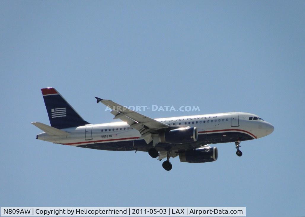N809AW, 1999 Airbus A319-132 C/N 1111, On final for runway 24 approximately 1/2 mile east of the airport