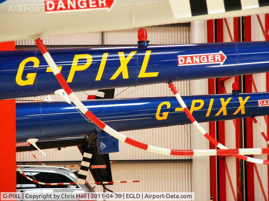 G-PIXL, 2006 Robinson R44 Raven II C/N 11221, along side G-PIXX