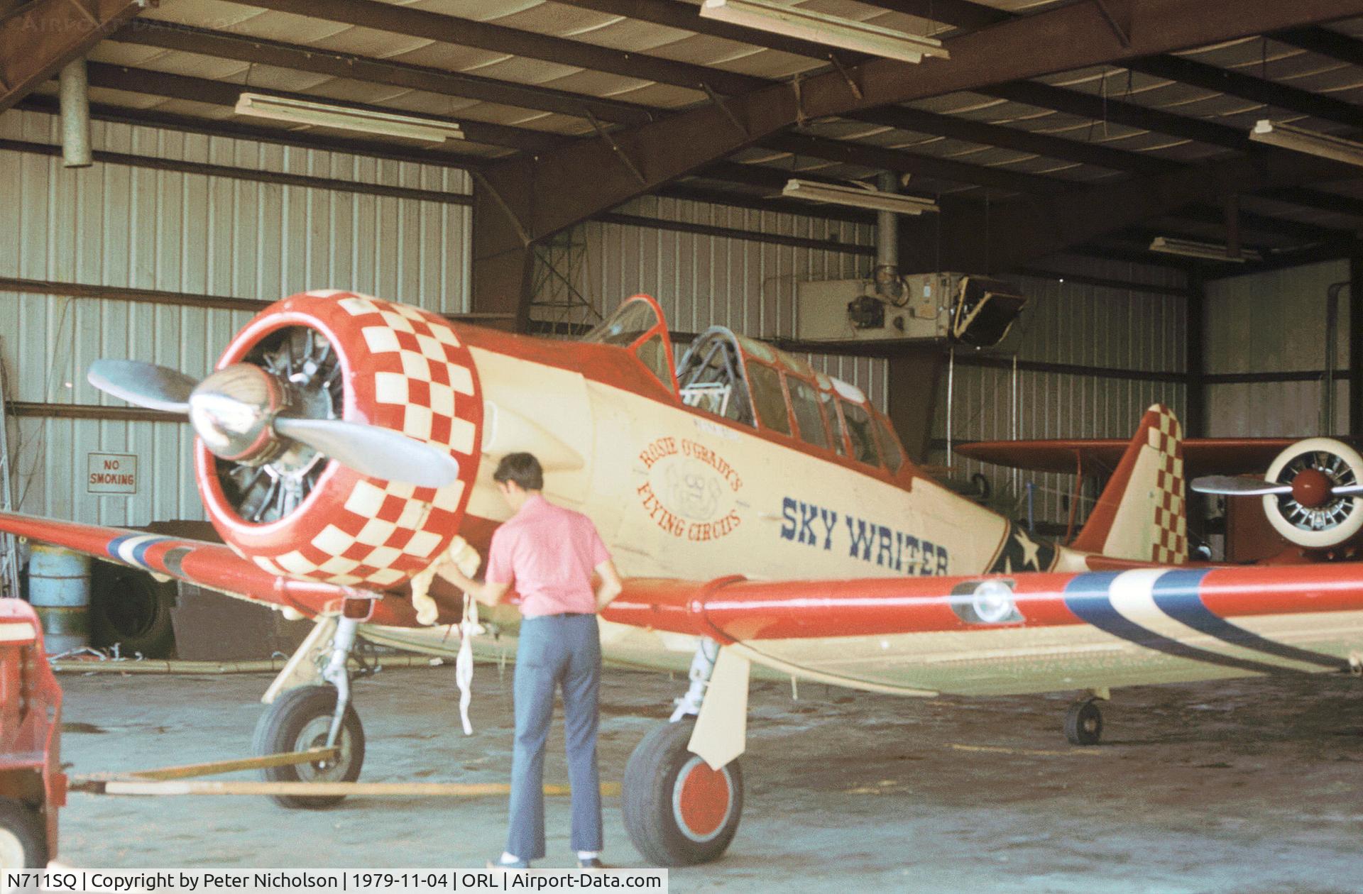 N711SQ, North American SNJ-4 Texan C/N 88-12709, SNJ-4 Texan of Rosie O'Grady's Flying Circus as seen at Herndon in November 1979.