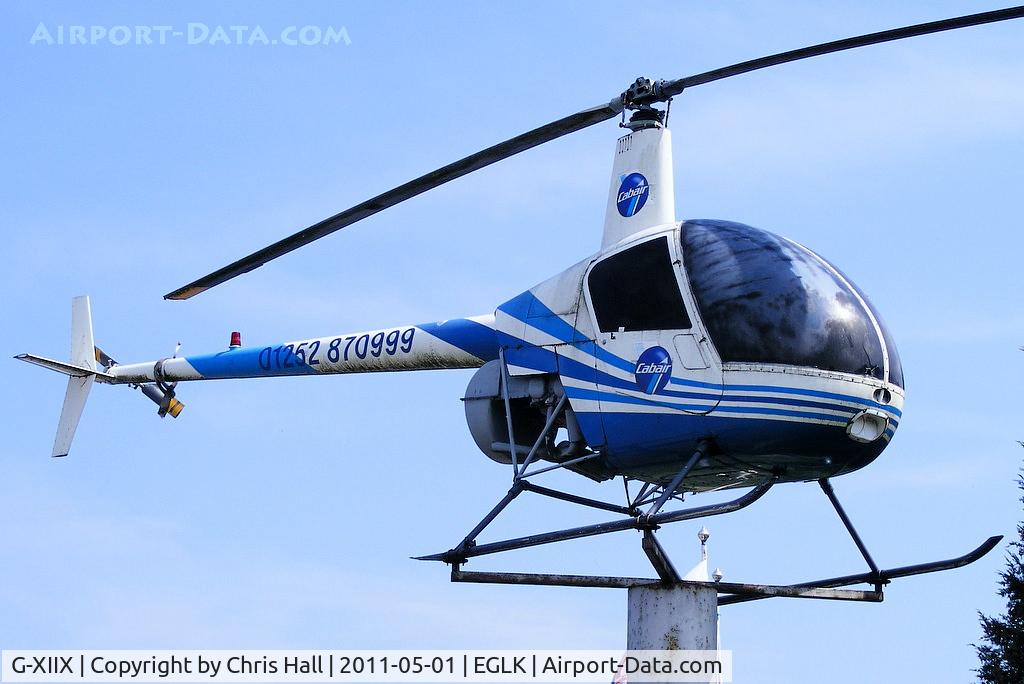 G-XIIX, 1988 Robinson R22 Beta C/N 0736, at the entrance to Blackbushe Airport