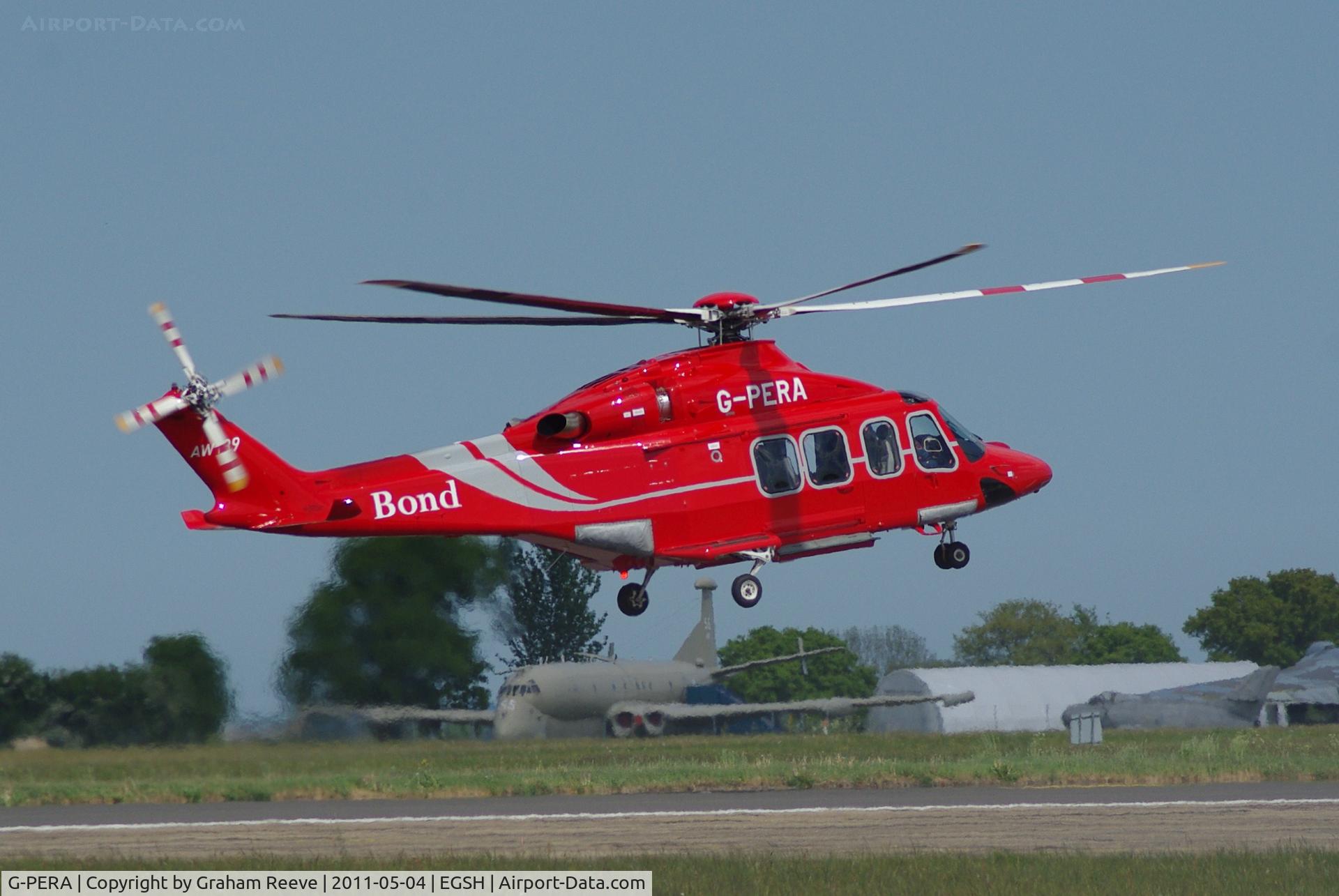 G-PERA, 2010 AgustaWestland AW-139 C/N 31322, In the hover, with a Nimrod in the back ground.