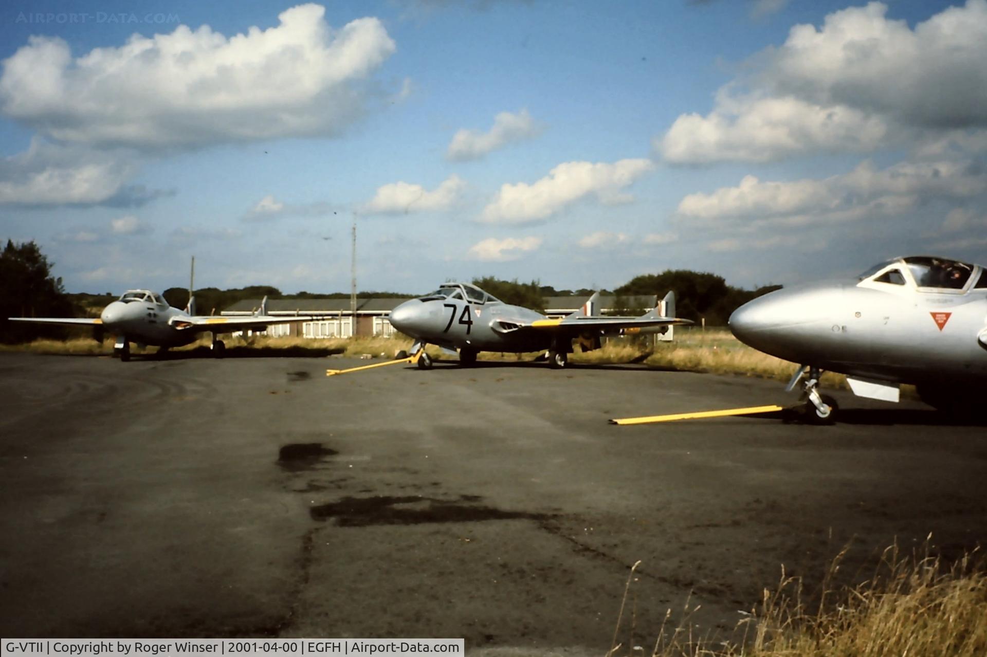 G-VTII, 1954 De Havilland DH-115 Vampire T.11 C/N 15127, With it's ex-RAF s/n WZ507 and coded 74, G-VTII is seen between her DHA sister aircraft G-VMPR and G-DHAV at a DHA open day spring 2001. Date is estimated.