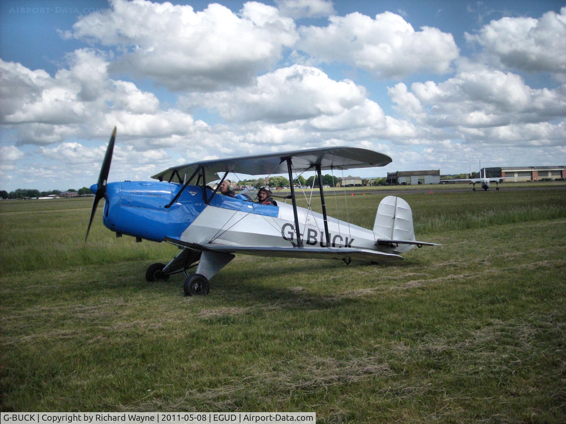G-BUCK, 1951 CASA 1-131E Jungmann C/N 1113, G-BUCK taxying on grass at Abingdon Air Show 2011