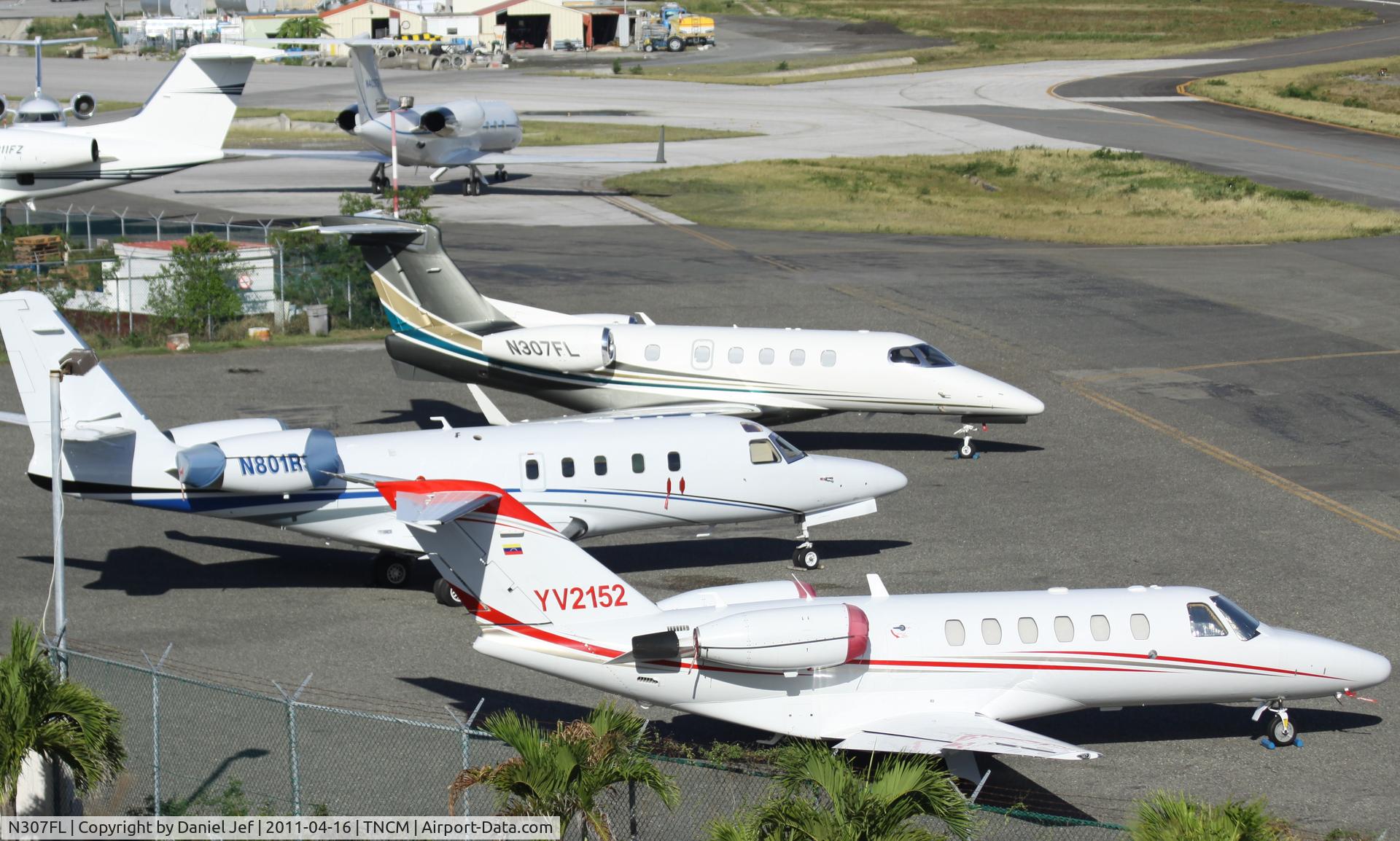 N307FL, 2011 Embraer EMB-505 Phenom 300 C/N 50500032, N307FL park on the cargo ramp at TNCM