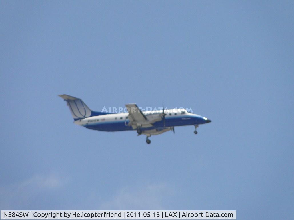 N584SW, 1999 Embraer EMB-120ER Brasilia C/N 120352, On final to runway 24
