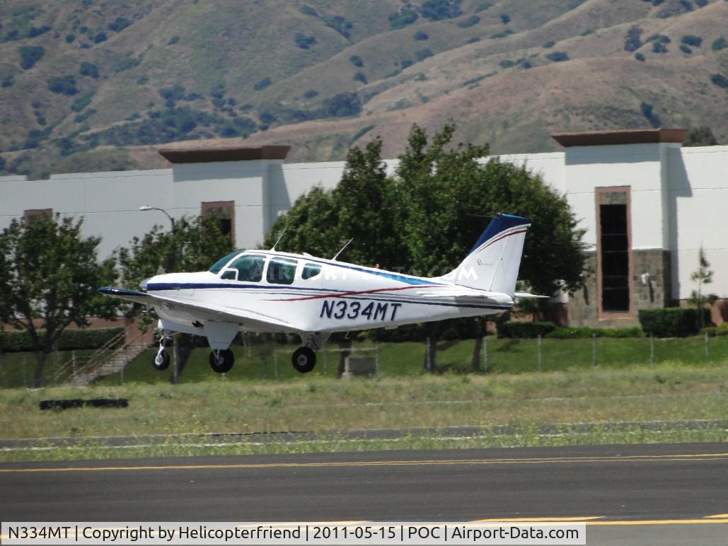 N334MT, 1962 Beech 35-B33 Debonair C/N CD-520, Airbourne from runway 26L and westbound